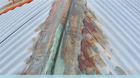 houses with rusty looking metal roofs|removing rust from metal roof.